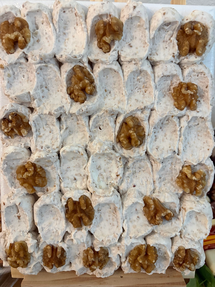 Individual desserts topped with walnuts