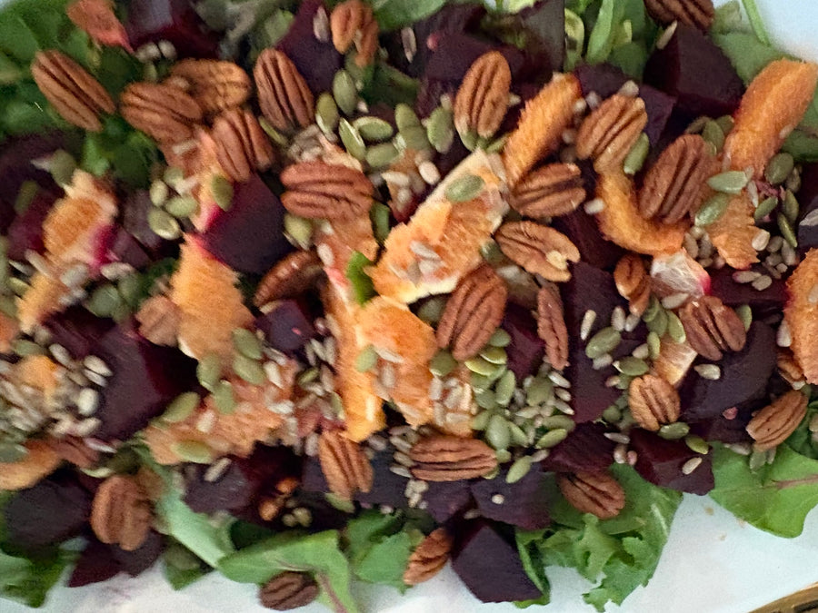 Colorful salad with pecans and citrus