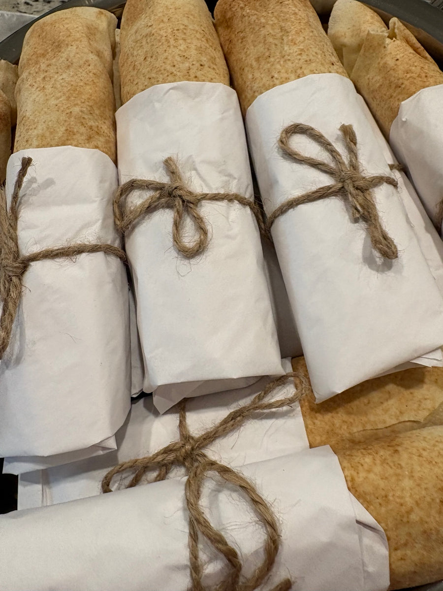 Wrapped rolls tied with twine for an event